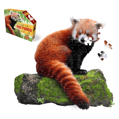 I AM Lil Red Panda Puzzle is shaped like a red panda on a mossy log.