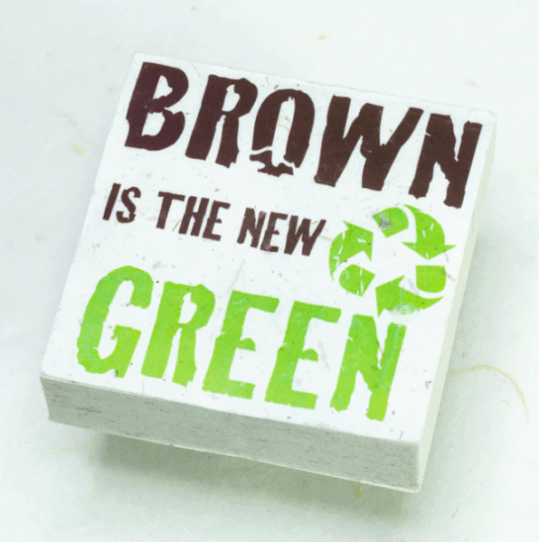 Image of paper scratch pad made out of poo with brown is the new green written on the front