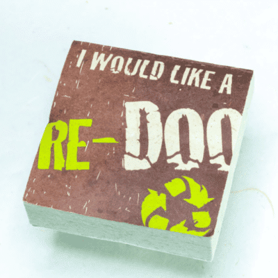Image of a paper scratch pad made out of poo with I would like a re-doo written on the front