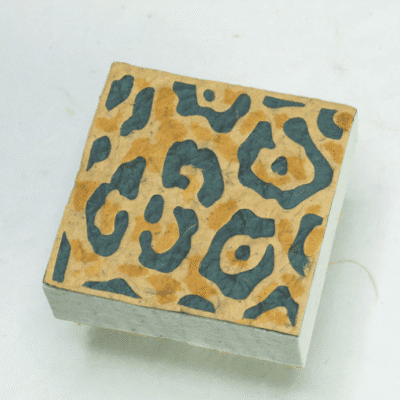 Image of paper scratch pad made out of poo with jaguar print on the front