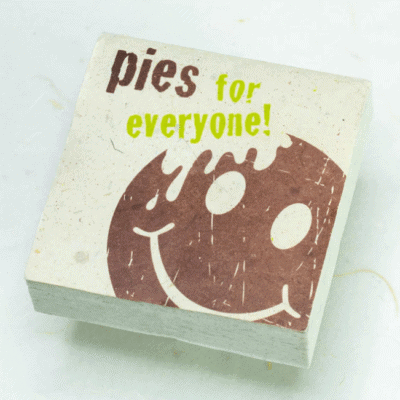 Image of paper scratch pad made out of poo with pies for everyone written on the front