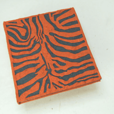 Image of a journal made out of poo with tiger print on the front