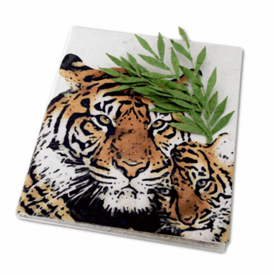 Image of a journal made out of poo with a mom and baby tiger on the cover