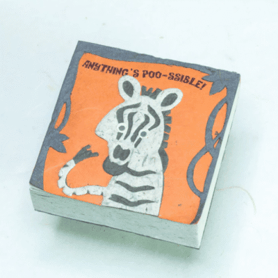 Image of a poo paper scratch pad with a zebra on it saying anything's poo-ssible