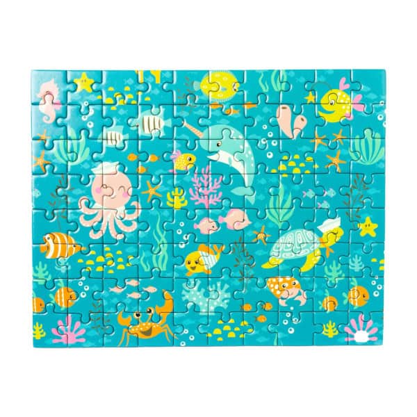 A completed Sealife Jigsaw Puzzle. Blue background with fun fish, a Narwhal, an octopus, and other sea creatures.