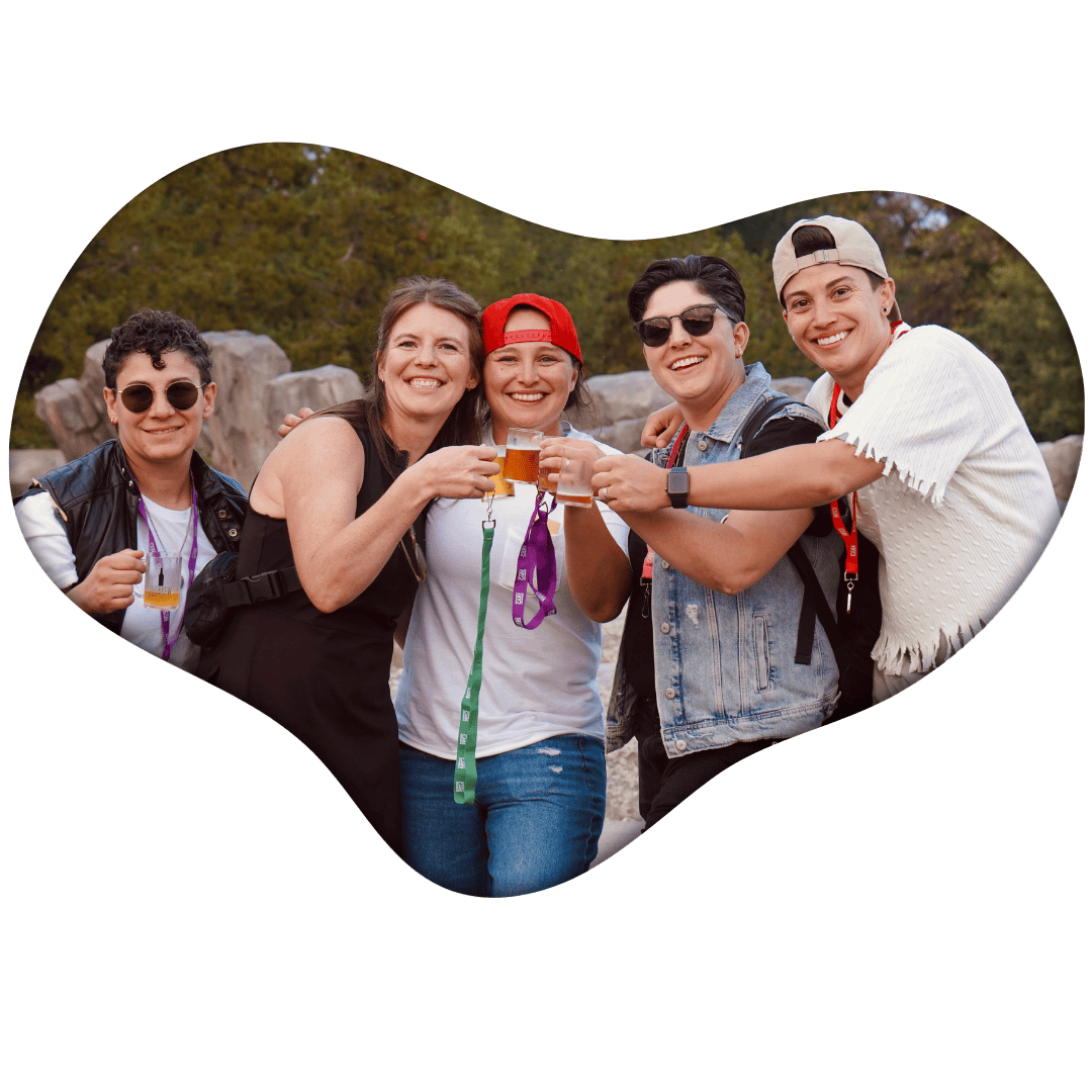 A group of happy atendees cheers each other with their Zoobrew mugs!