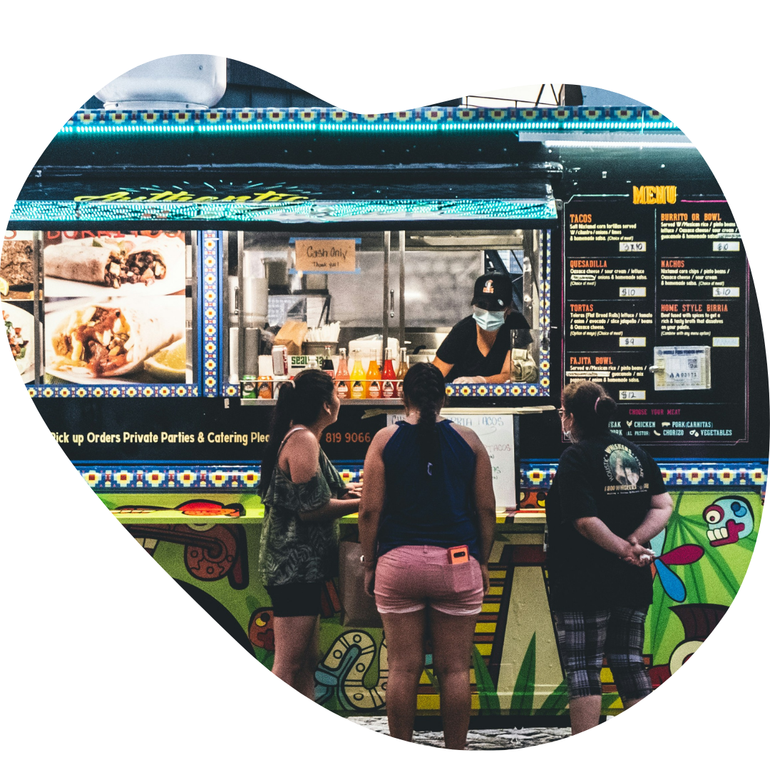 Foodtruck_Generic A man sells tacos from a food truck