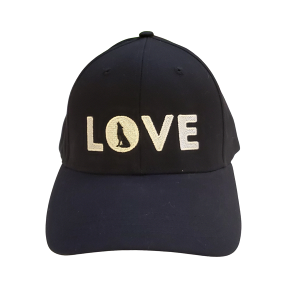 Image of black baseball cap with white word love. The 'o' contains the silhouette of a wolf howling.