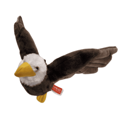 Image of bald eagle plush toy in flight.