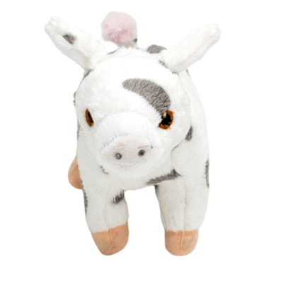 Image of white plush toy pig with grey spots.